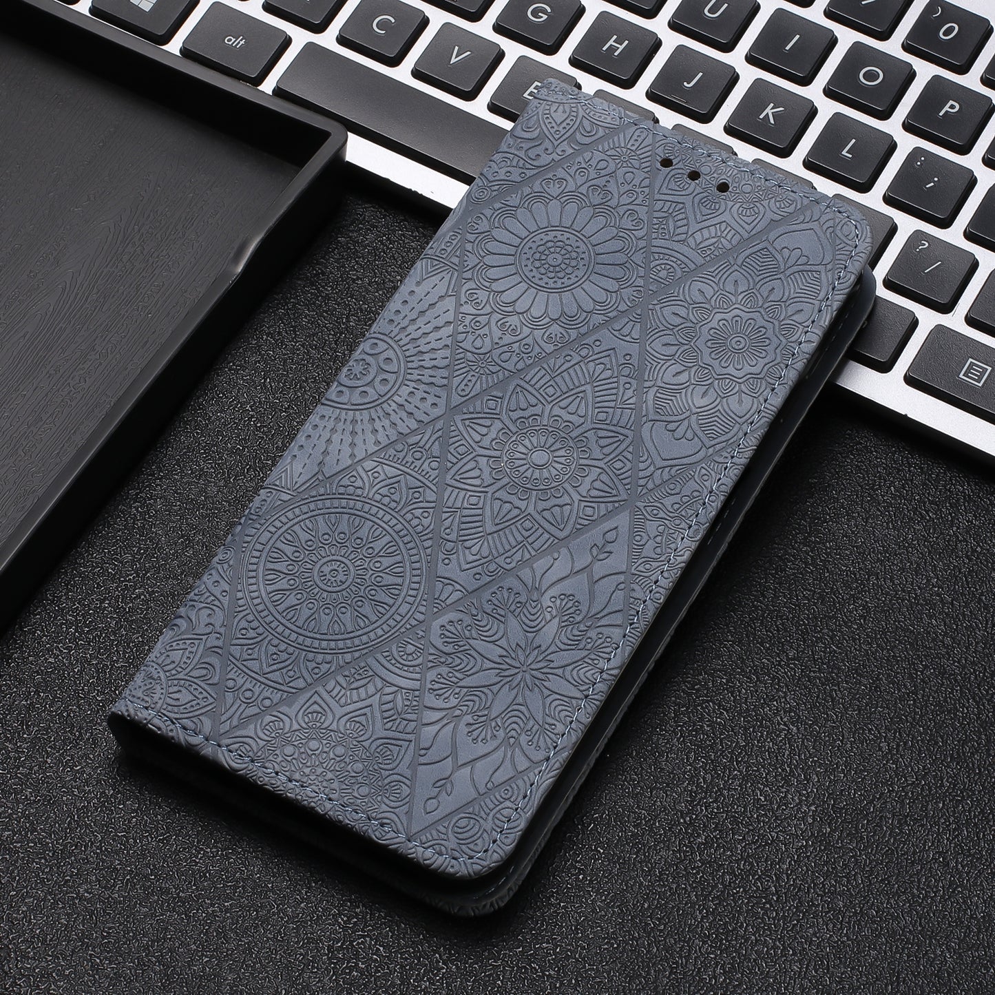 For iPhone 15 Plus Ethnic Embossed Adsorption Leather Phone Case